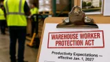 McKee signs warehouse worker protections into law, sets new rules for quotas and breaks